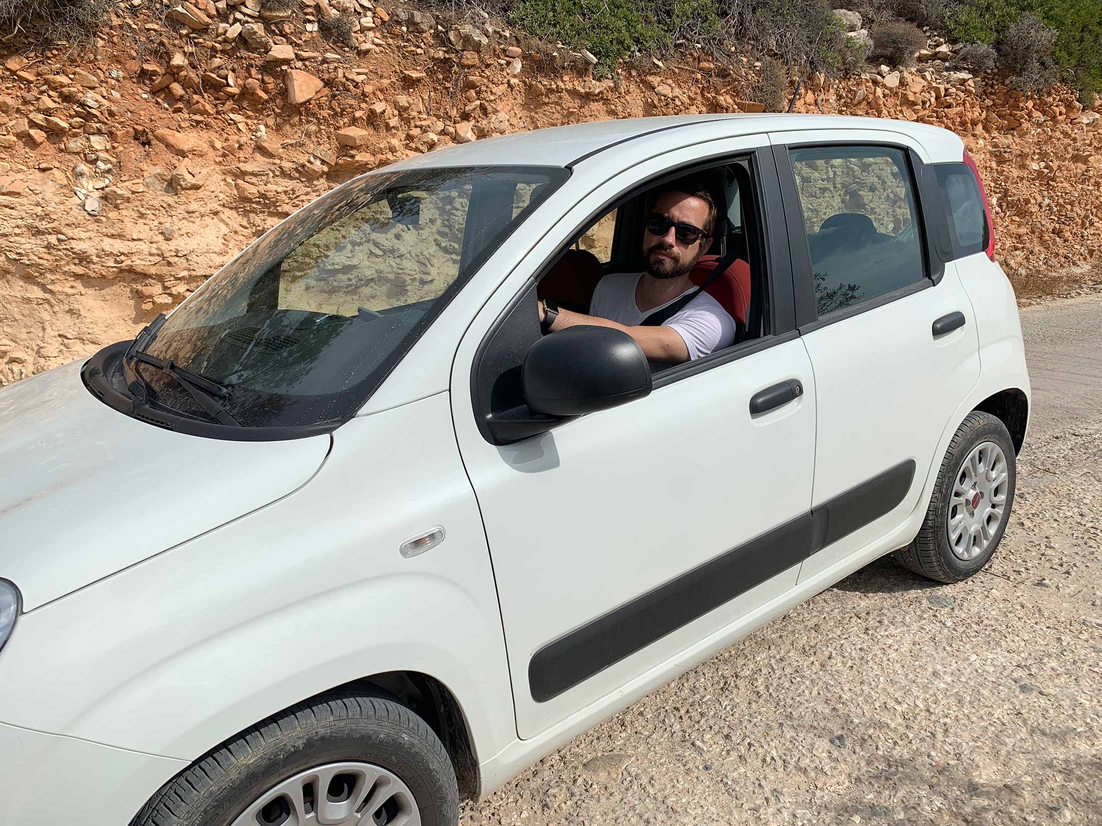 Guilly in the Sardis rental car in Paros island, Greece