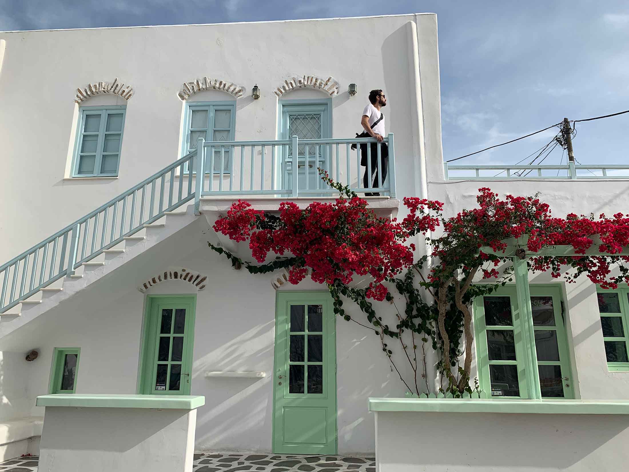 Guilly with whitewashed house and beautiful bougainvillea in Antiparos